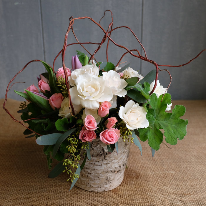 pink spray roses, white roses, scrented geranium, purple tulips by Michler's florist