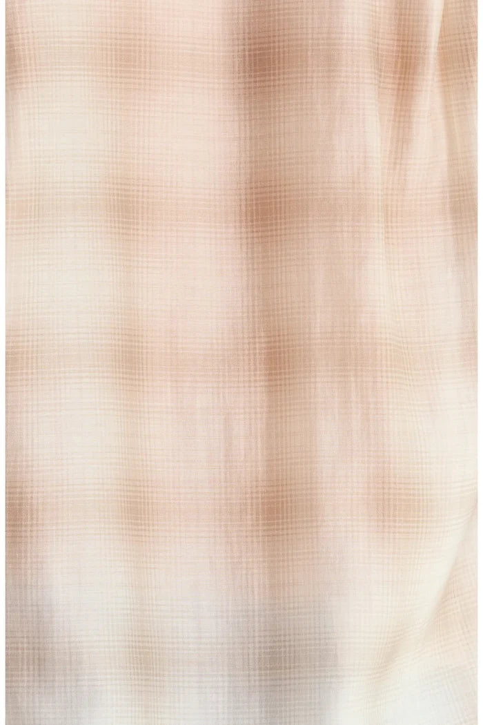 A close-up of a lightweight, semi-sheer fabric with a fine grid or gingham pattern in soft beige and light brown tones.