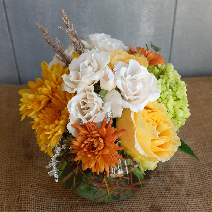 Lush flower bouquet in muted autumn tones.