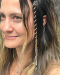6 inch mini silver hair twister in long wavy blonde hair, spiral metal hair accessory with charm, styled in braid, side view